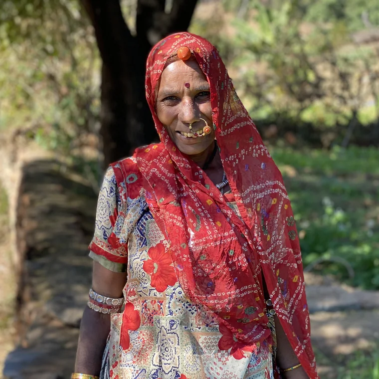 A Rajasthani woman in a traditional odhni in her village courtyard