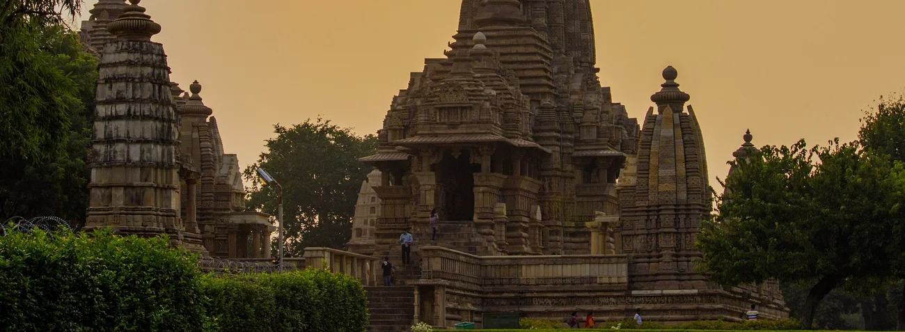 The Kandariya Mahadeva temple at Khajuraho against a sunset sky