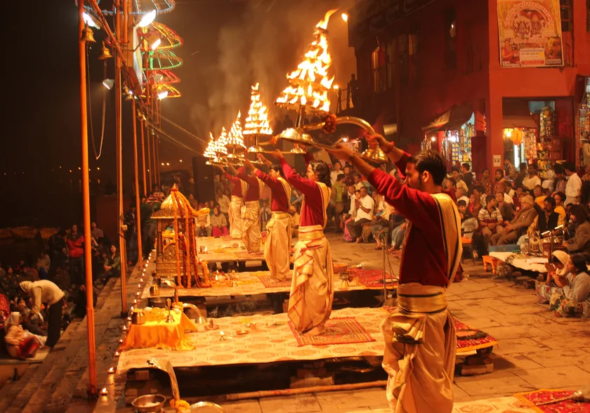 The evening Ganga Aarti lit by oil lamps on the ghats of Varanasi