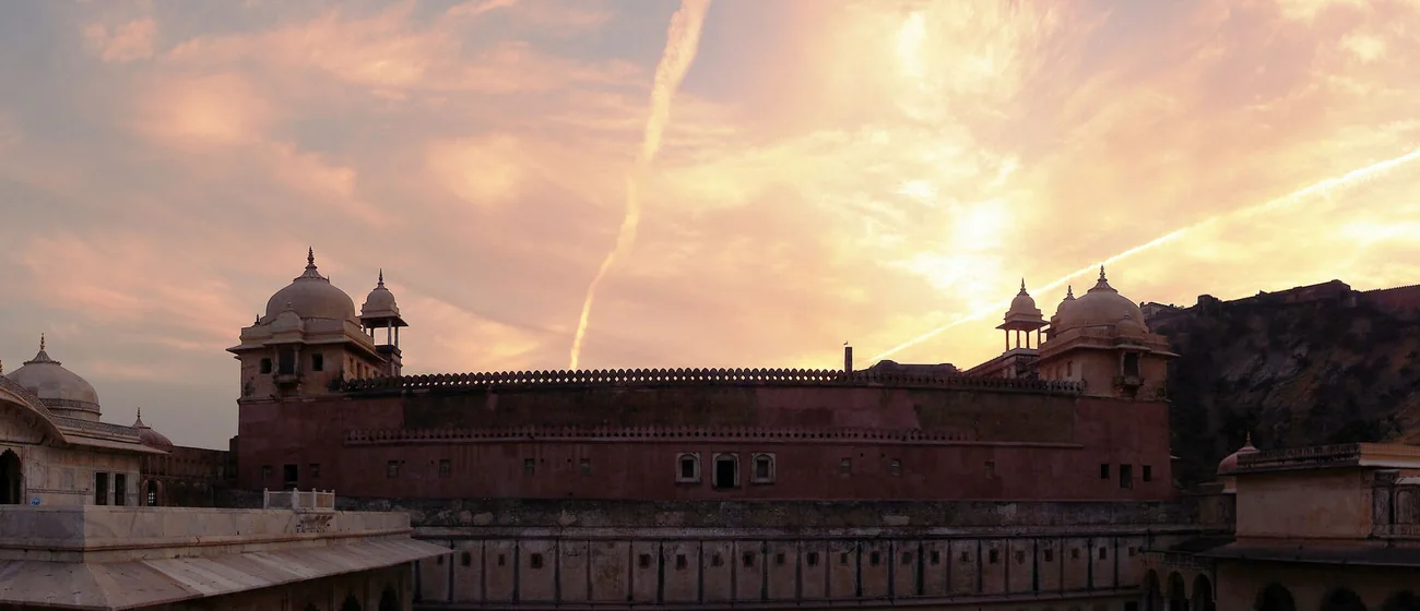 Amber Fort silhouetted against a dusk sky at Amer, near Jaipur